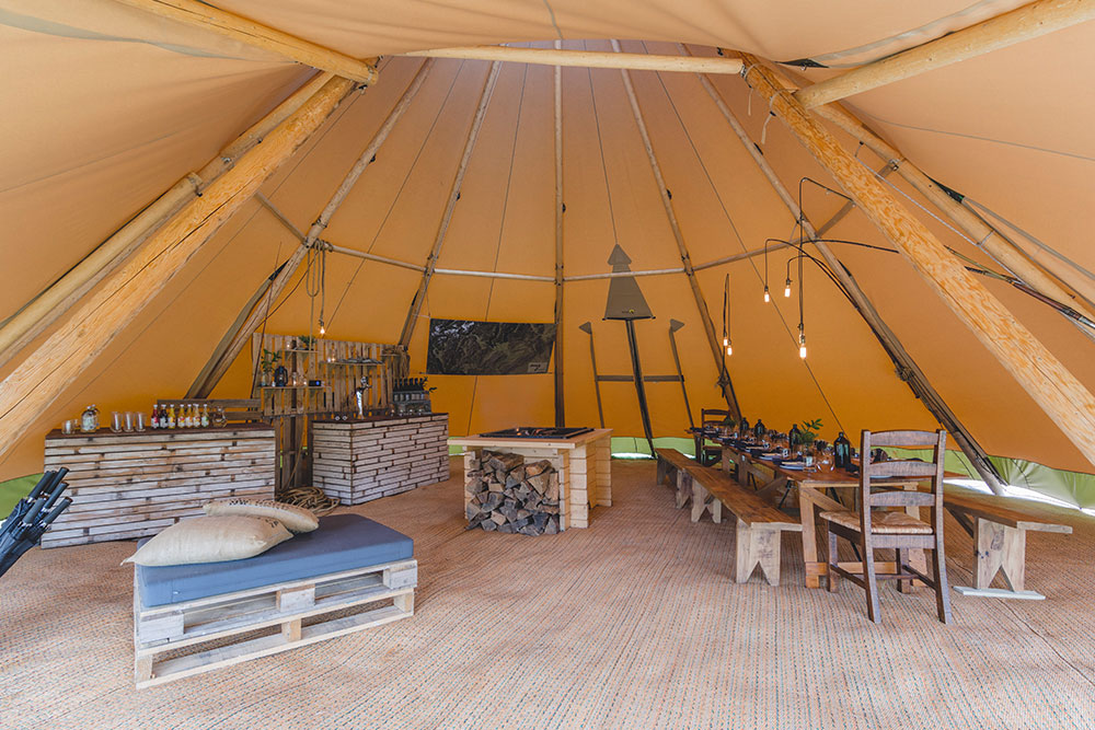 Gather and Gold tipi events - stylish set up inside tipi with table and bar for the Jeep Wrangler launch event in Otago, New Zealand.