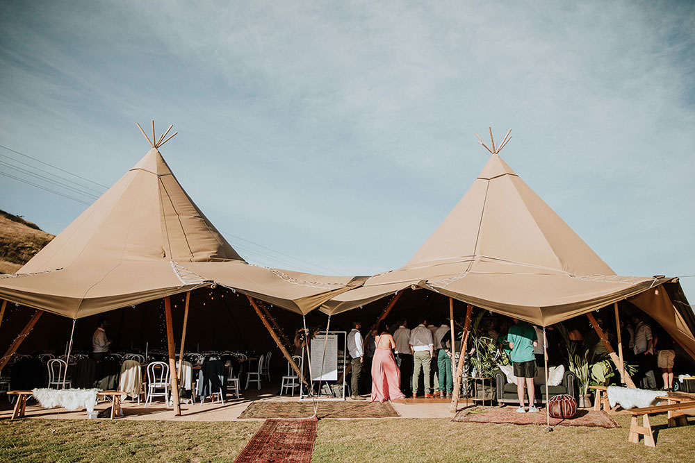 Tipi wedding by Gather and Gold - double tipi set up, joined to provide cover, one area for dining, one for dancing