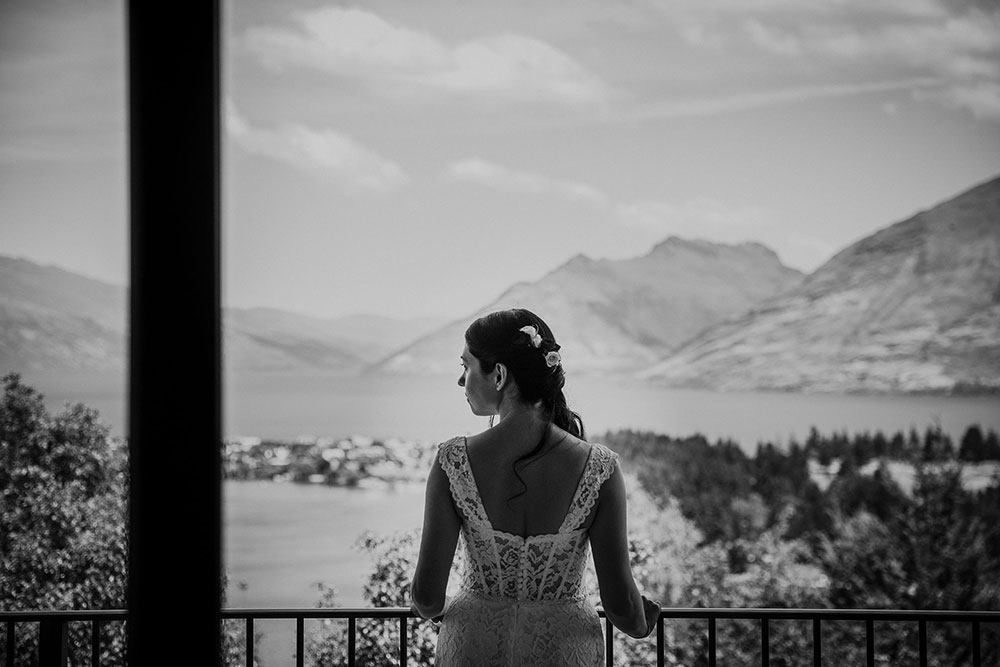 Black and white bride looking out over Queenstown