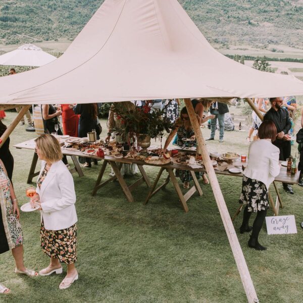 Gather and gold small tipi hire - mini hat teepee set up in front of lake with table seating