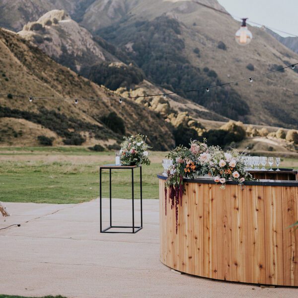 Gather and Gold teepee - circular bar leaner with view of mountains in the background in Queenstown