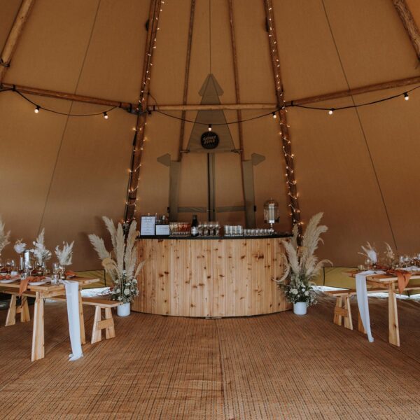 Gather and Gold hire a tipi - bar and table seating inside a tipi