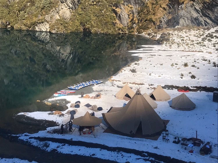 Gather and Gold Tipis beside a lake in the south island with kayaks