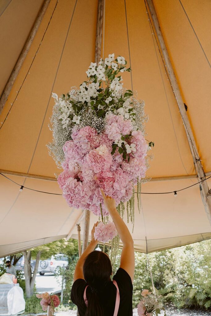 Hanging floral arrangement in a Gather and Gold Nordic tipi