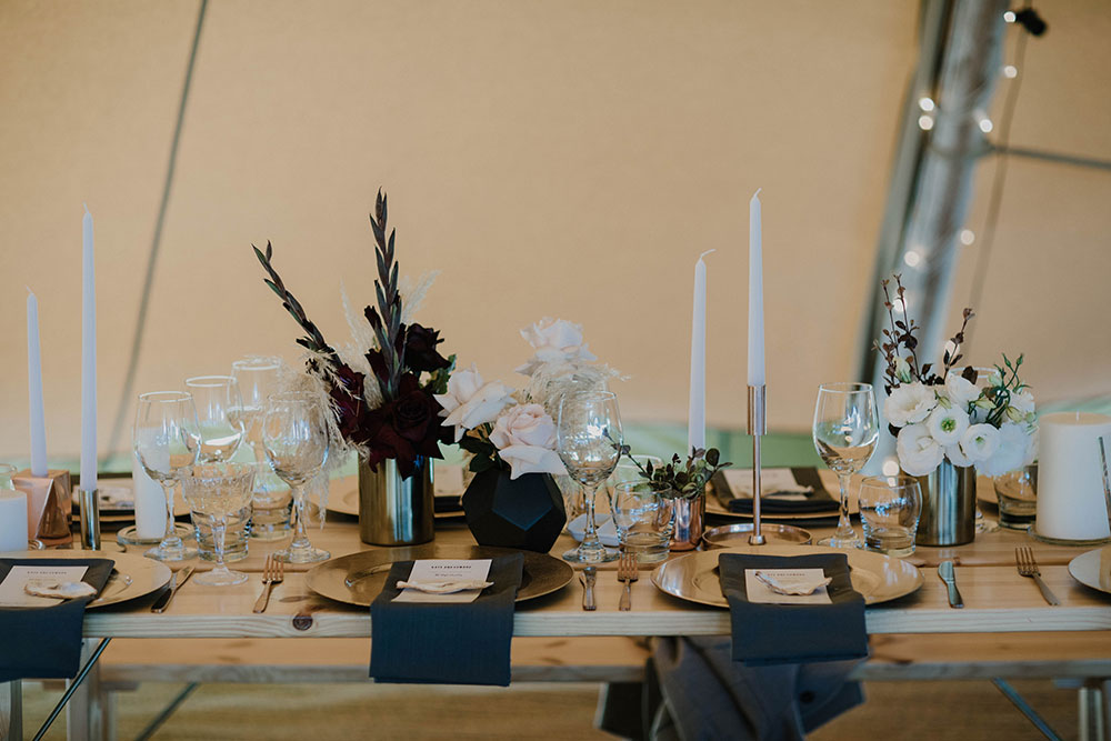 Wedding table settings in a Gather and Gold nordic bell tipi