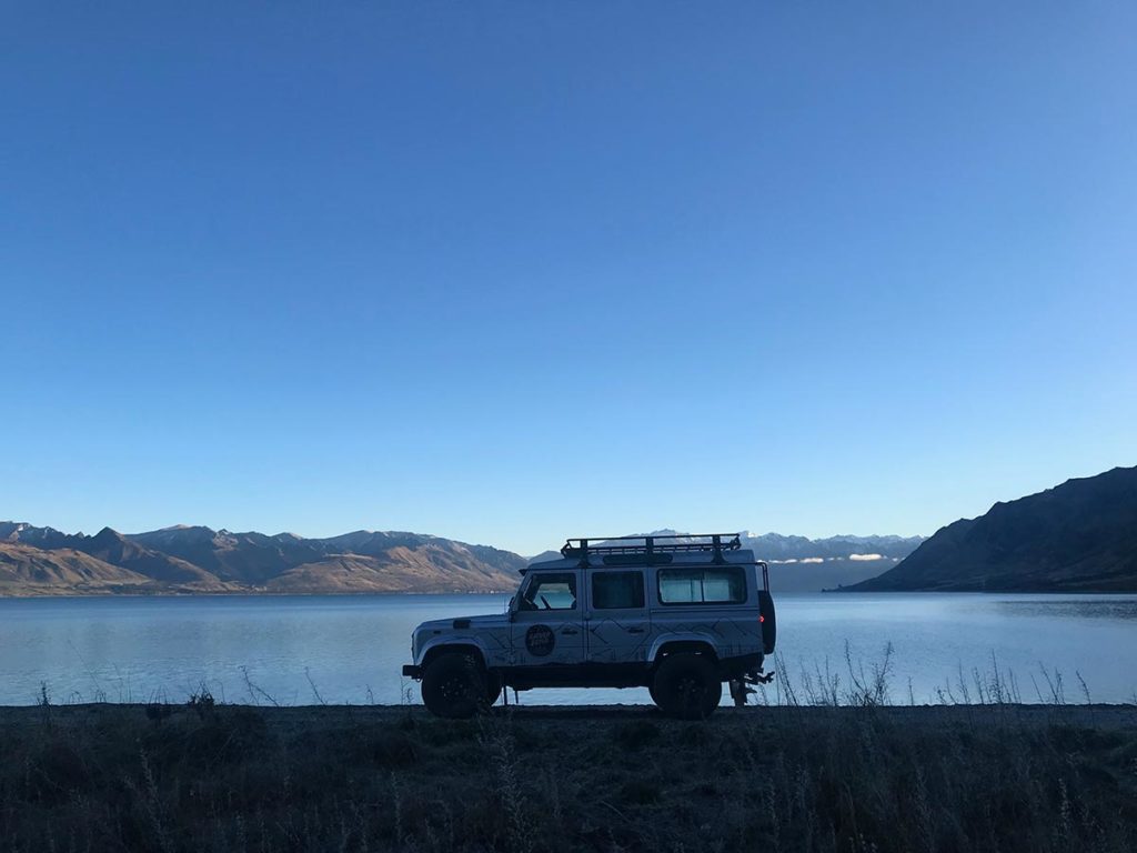 Gather and Gold recommend local activities in Queenstown and Wanaka. Jeep next to lake.