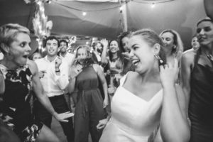 Black and white happy bride in a tipi wedding - Top tips for a fun wedding day