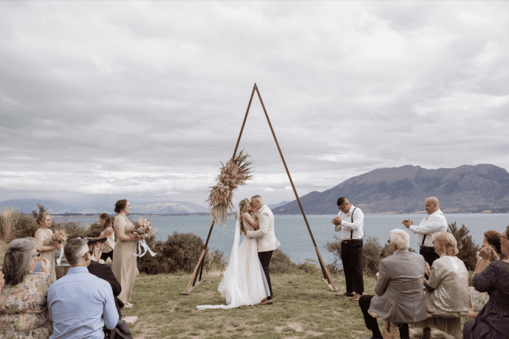 Wedding ceremony overlooking a lake at Lake Hawea Station